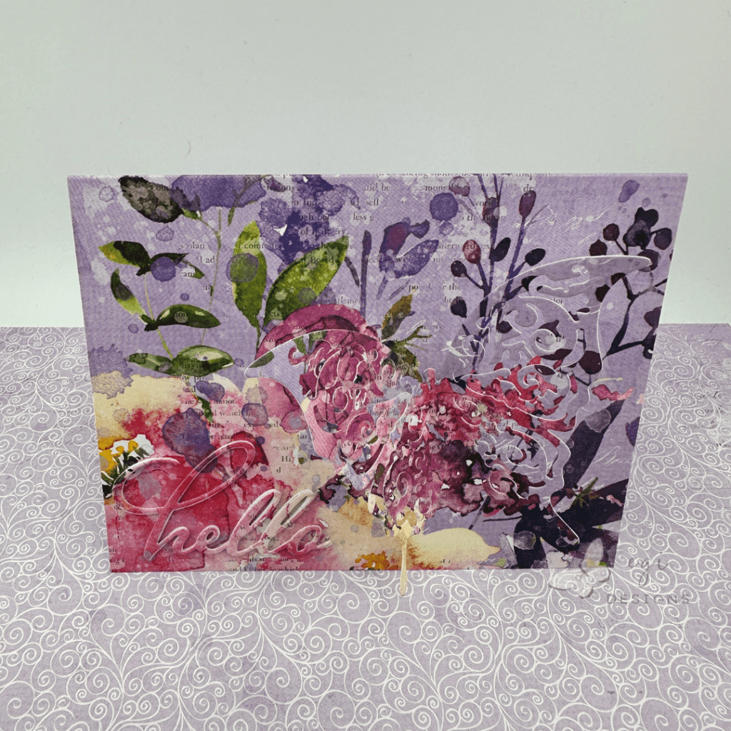 top down view of layered die cuts butterfly card 49 and market color swatch: lavender patterned paper