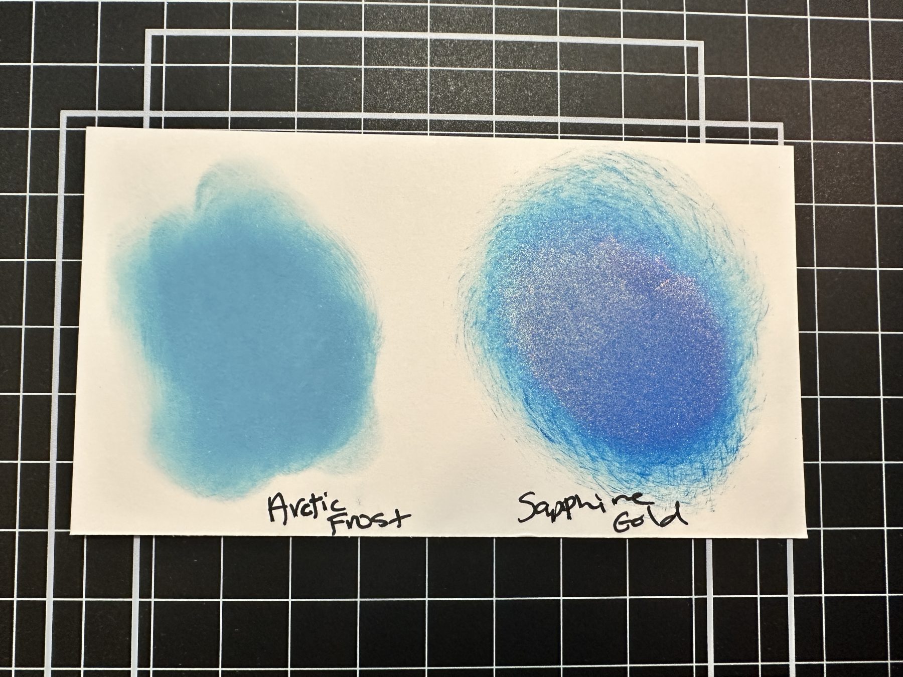 picture of ink swatches of Lisa Horton Crafts Matt Ink in Arctic Frost and Sapphire Gold Interference Ink