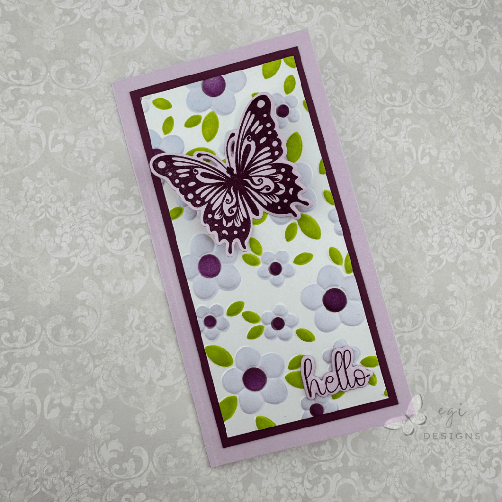 photo of mini slimline card made using gina k designs contemporary floral 3d embossing folder and stencils, with the celebrate you stamp and die set