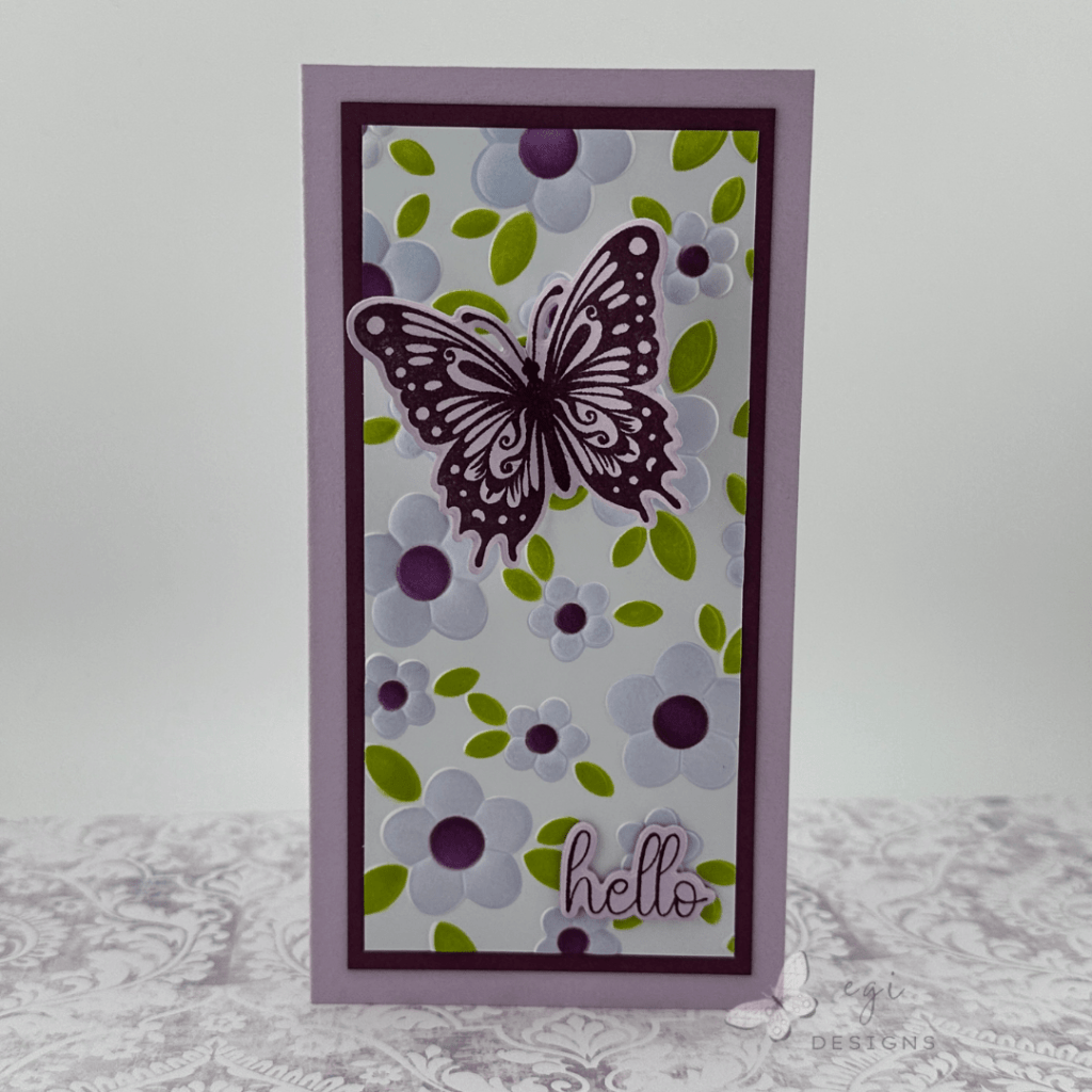 photo of mini slimline card made using gina k designs contemporary floral 3d embossing folder and stencils, with the celebrate you stamp and die set