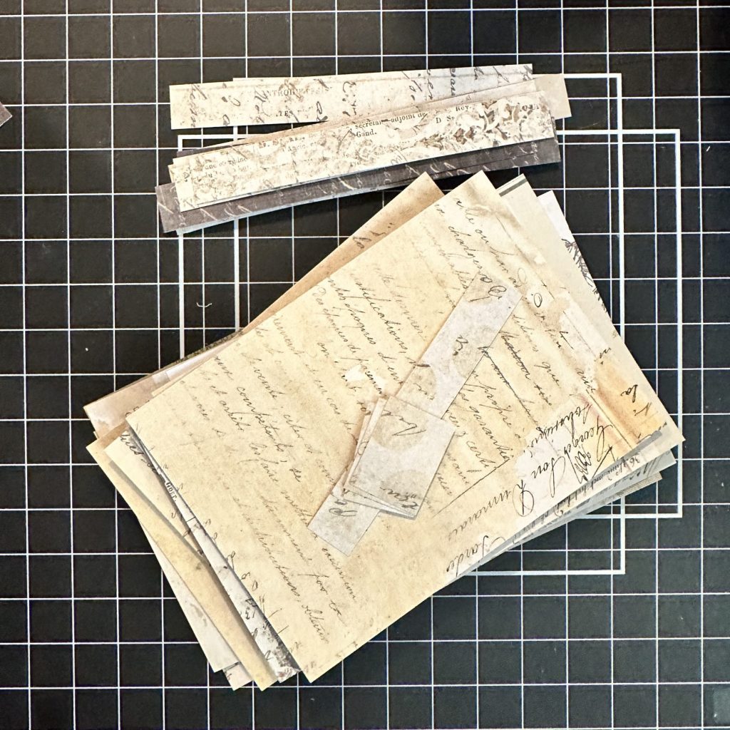 photo of Cut pieces for card, stacked in packages ready for assembly