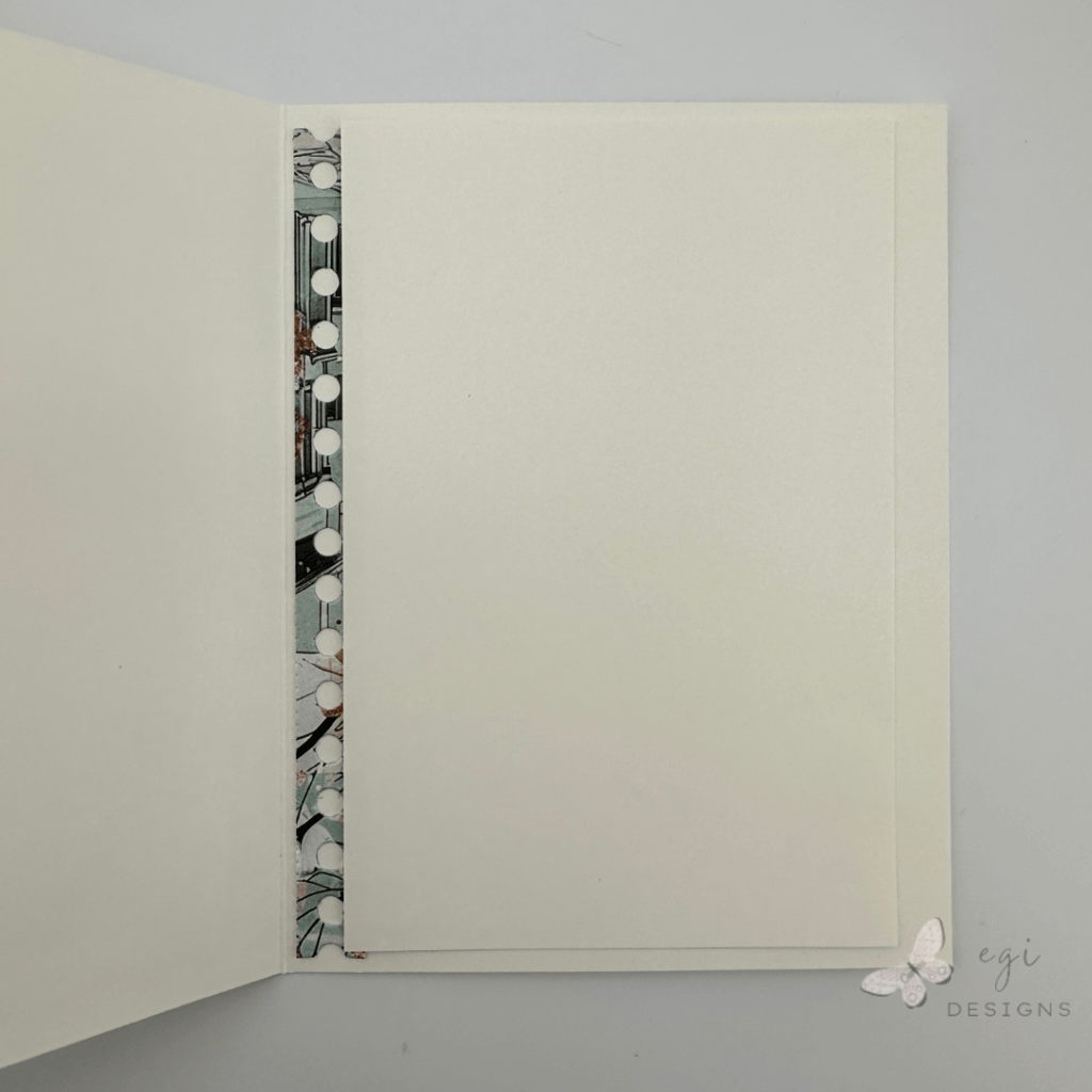 photo of the inside of the card where i added a strip cut from the la-la land crafts in the city patterned paper