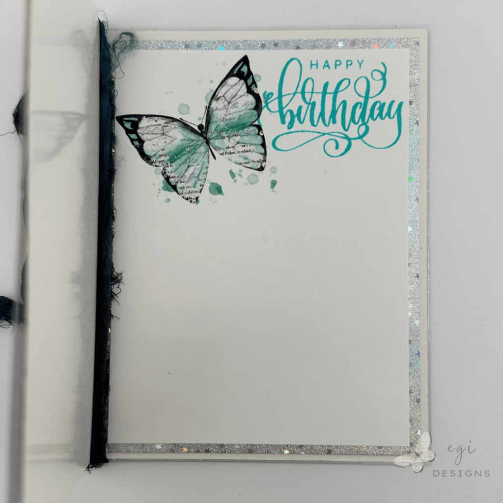 photo of Inside of card: Decorated with a 49 and Market Viken Rub-on and Gina K Designs Fancy Phrases Stamp Set, on top of a white panel, and a mat layer made from Scrapbook.com Holographic Mirror Paper