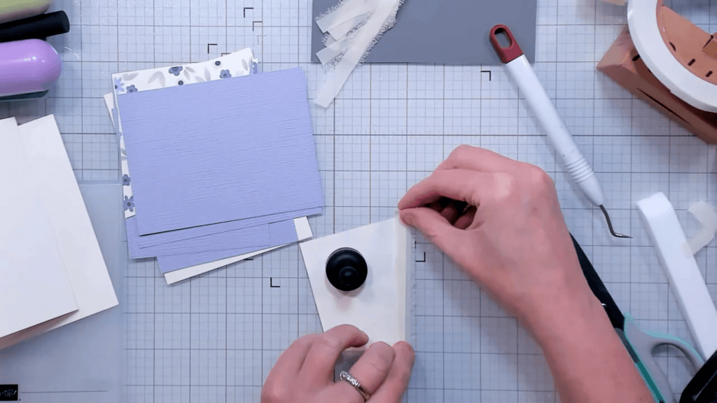 photo of Applying the ribbon strips to the adhesive tape