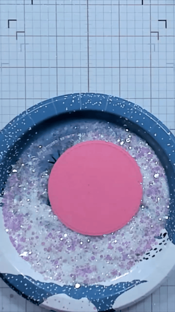 photo of Placing Adhesive Sticky-Side-Down into the Glitter Mix