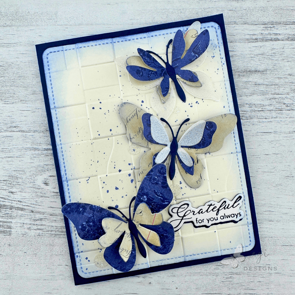 photo of finished card using altenew fluttering fantasies, tim holtz palette: indigo paper