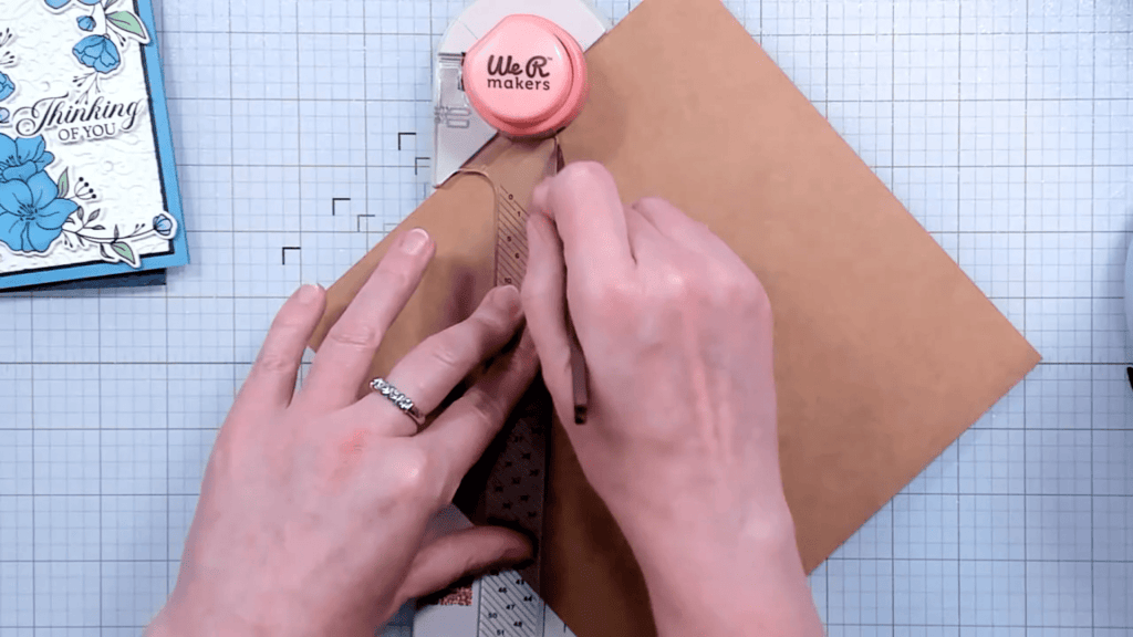 photo of Drawing a score line down, along the clear guide